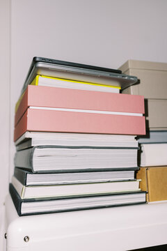 Stack of Neatly Organized Books and laptops