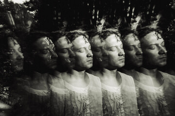 Repeated black and white portrait with closed eyes and layered effect
