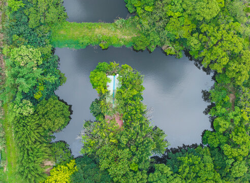 Aerial Farm Structure Surrounded by Water and Spring Greenery