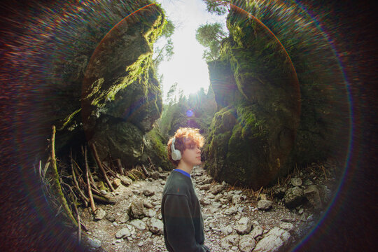 A guy enjoys music in nature