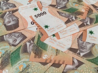 Indonesian money, close up five thousand rupiah,5000 banknotes scattered 