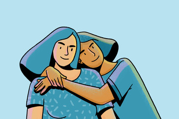 Two smiling friends hugging each other showing support and care