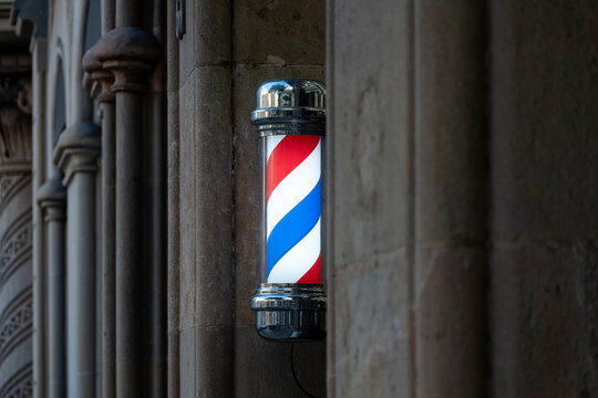 Rotating Barber Pole in Front of Modernist Building