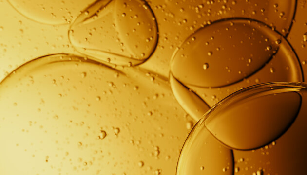 Abstract Composition of Bubbles in Amber-Colored Liquid Background