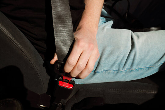 Fastening Seat Belt in Car