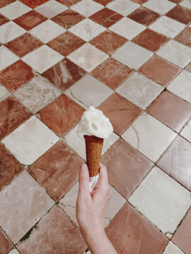 Hand holding an ice cream.
