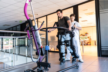 Patient using exoskeleton robotic suit walking