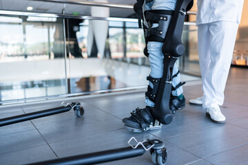 Patient using exoskeleton robotic legs for physical therapy