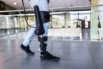 Patient walking using exoskeleton robotic leg in rehabilitation center