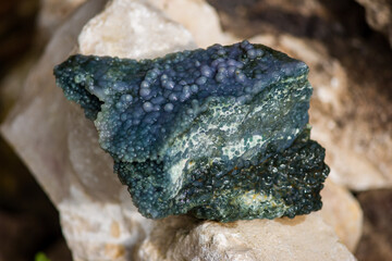 Blue-green collectible specimen of water-wetted grape agate, also known as amethyst quartz or grape...