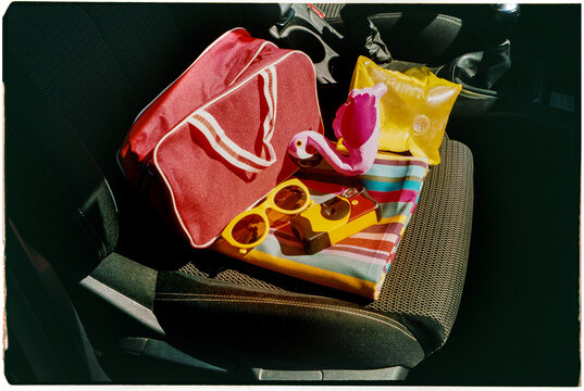 summer stuff and disposable camera on a car, 35mm