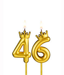 Golden number 46 birthday candle on white background