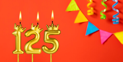 Number 125 candle - Birthday celebration on an orange background with pennants