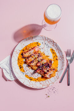 Octopus with creamy mashed potatoes, paprika oil and black salt