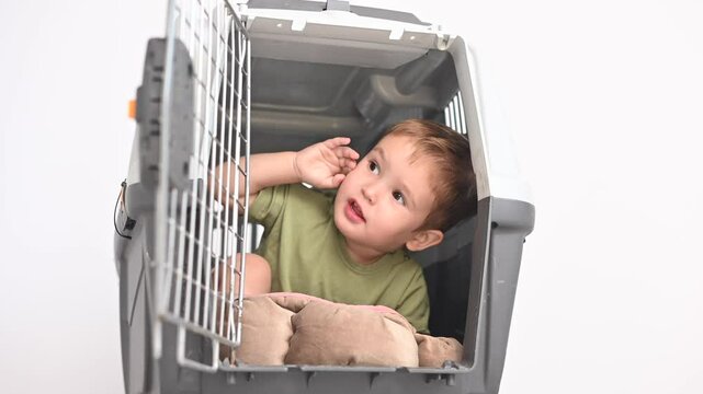 A small child in a closed cage.