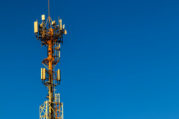 Telecommunications tower against a clear blue sky in Brazil, vital for modern communication infrastructure.