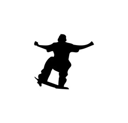 Silhouette of a skateboarder performing a trick.