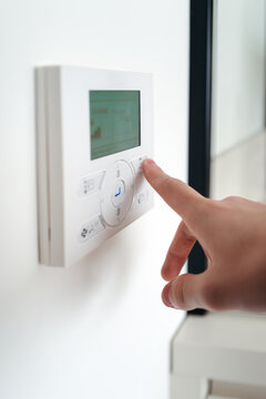 Adjusting the Temperature on Modern Thermostat for Energy Efficiency