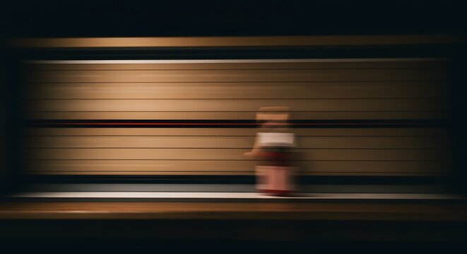 Blurred Motion of a Person Walking Through a Wooden Walled Corridor, Low Light Photography