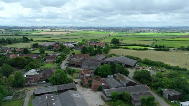 aerial view of a village in in England surrounded by rural landscape UK