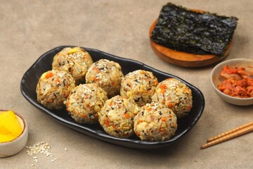 Korean rice balls or Jumeokbap (주먹밥) are a quick and easy snack or lunch made with leftover rice and various fillings that are shaped into a ball