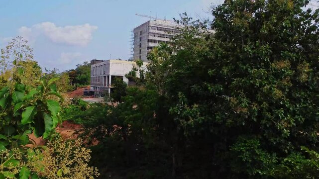 A beautiful hotel hidden behind green trees under renovation in Ibadan, Nigeria