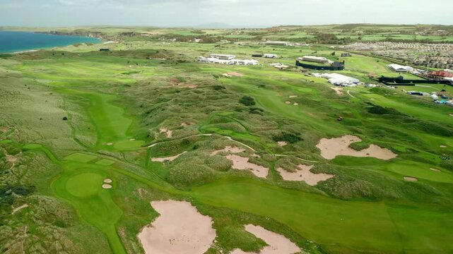 Wide reversing 4K aerial video of Royal Portrush Golf Club in Northern Ireland, UK. Filmed in 60 frames per second and with Rec709 color.