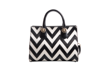Chic Handbag with Black and White Chevron Pattern, Gold Hardware, and Sleek Black Handles on a Dark Background isolated on transparent background