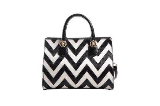 Chic Handbag with Black and White Chevron Pattern, Gold Hardware, and Sleek Black Handles on a Dark Background isolated on transparent background
