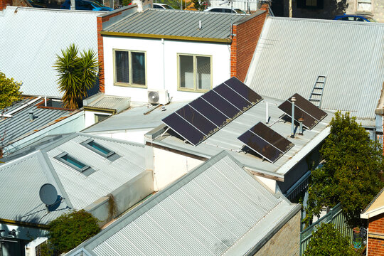 Solar panels on rooftops in an urban area