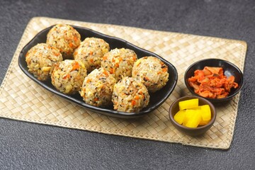Korean rice balls or Jumeokbap (주먹밥) are a quick and easy snack or lunch made with leftover rice and various fillings that are shaped into a ball