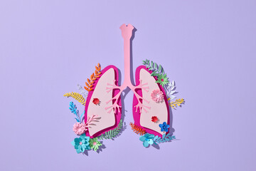 A paper lung art piece featuring a floral arrangement