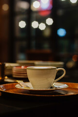Cup of coffee on the counter with blurred background