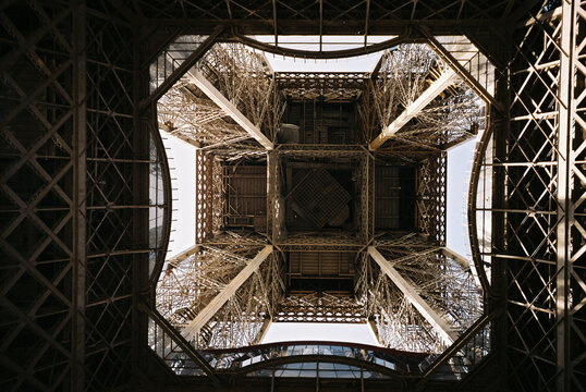 Intricate iron lattice structure view from below with geometric shapes