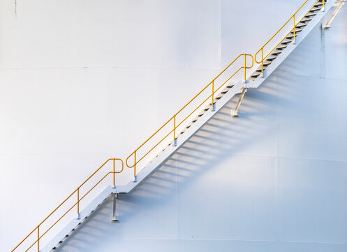 Steps rising up a gas tank in a fuel depot