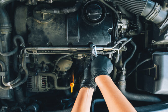 Car Mechanic Doing Maintenance 
