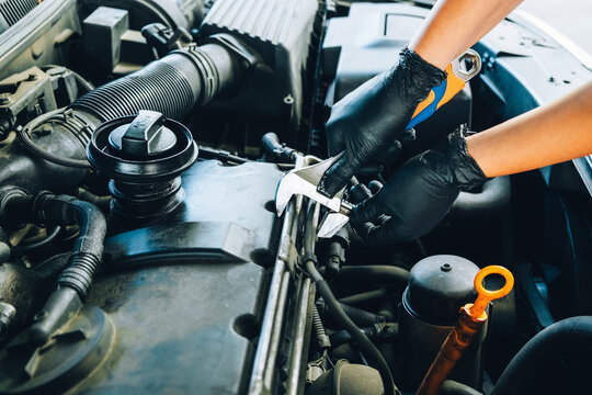 Car Mechanic Doing Maintenance 