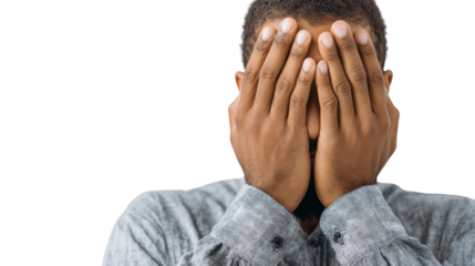 A person covering their face with hands, expressing emotions such as sadness, frustration, or stress.