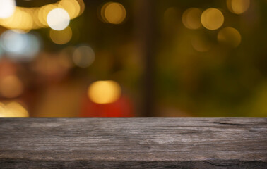 Empty wood table top and blur of restaurant background selective focus product display