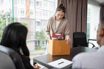 Quit Job asian business woman sending resignation letter and packing Stuff Resign Depress or...