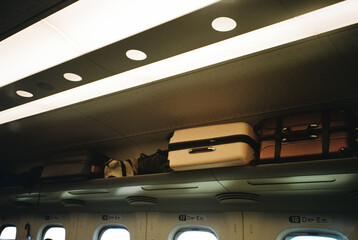 Luggage Stored Above Seats in Japanese Bullet Train