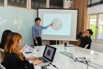Motivated professional team members gathered together at corporate seminar raise hand, agree with...
