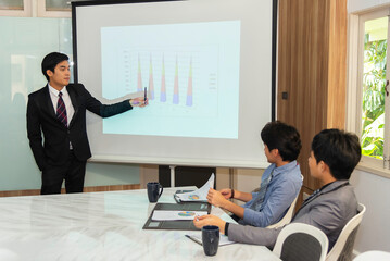 Motivated professional team members gathered together at corporate seminar raise hand, agree with...
