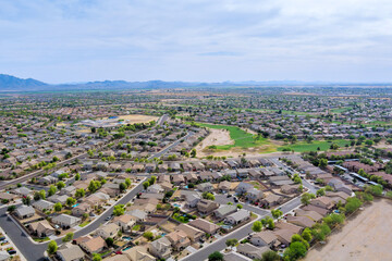 Residential neighborhood with single family homes, organized street grid, southwestern suburban development with geometric street patterns, in Avondale, Maricopa County, Arizona.