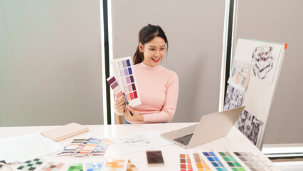 Asian Interior Designer Choosing Color Palette for Home Decor Project Asian Woman Design Studio...