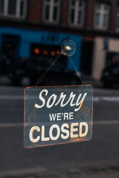 Vintage &ldquo;Sorry, We&rsquo;re Closed&rdquo; Sign on Glass Door