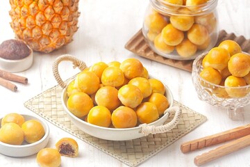 Nastar is a dry cake made from a mixture of wheat flour, butter and eggs filled with pineapple jam