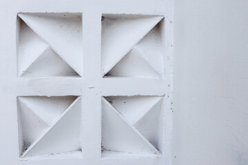 Close Up Of White Concrete Block With Geometric Triangular Design