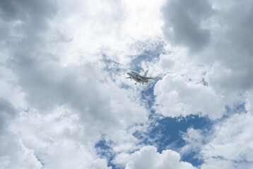 Fighter jet flies through the sky on technology background