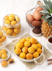 Nastar is a dry cake made from a mixture of wheat flour, butter and eggs filled with pineapple jam